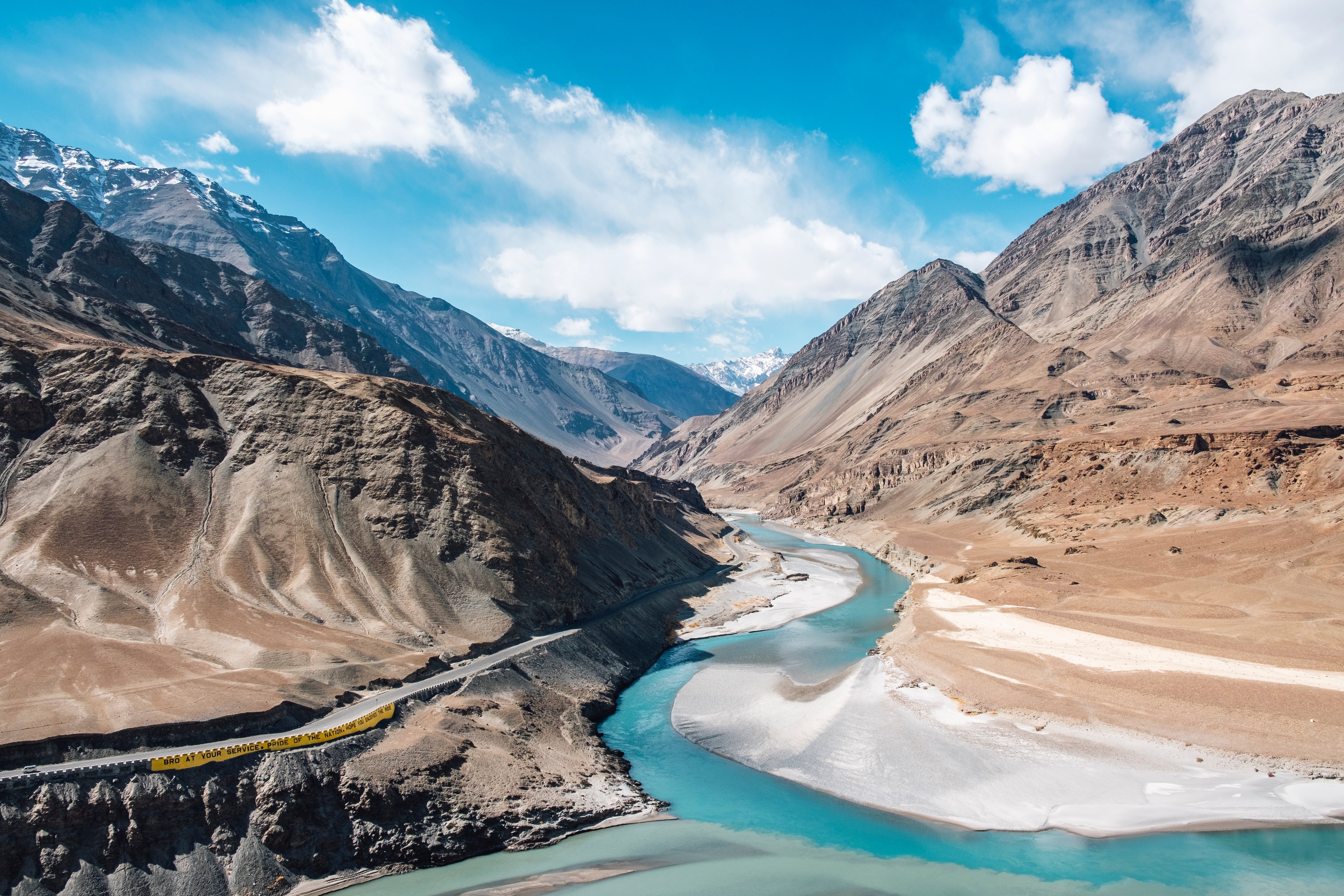 Mountain monastery overlooking a remote Ladakhi valley under clear blue skies